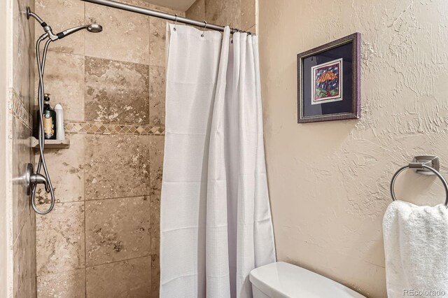 2838 Decatur St, Denver, CO 80211 - full bathroom featuring a tile shower and toilet