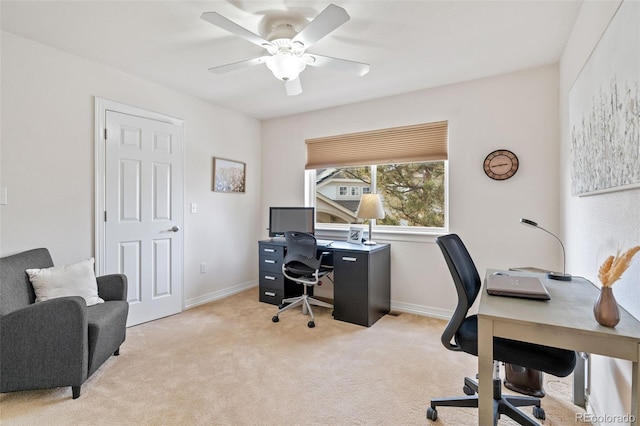 home office with light carpet and ceiling fan