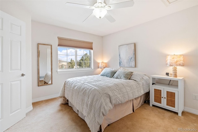 bedroom featuring light carpet and ceiling fan