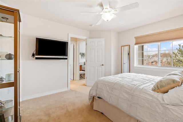 bedroom featuring light carpet and ceiling fan