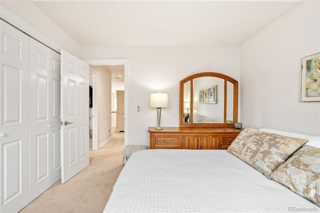 carpeted bedroom featuring a closet