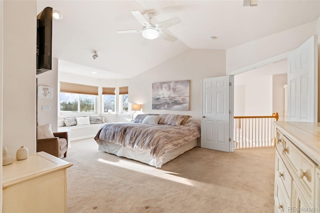 bedroom with light carpet, lofted ceiling, and ceiling fan