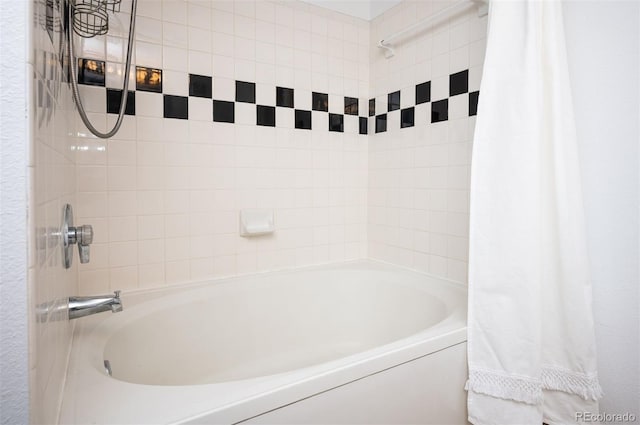 bathroom with shower / bathtub combination with curtain