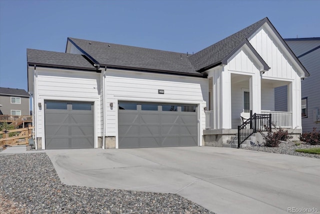 view of front of house featuring a garage and covered porch