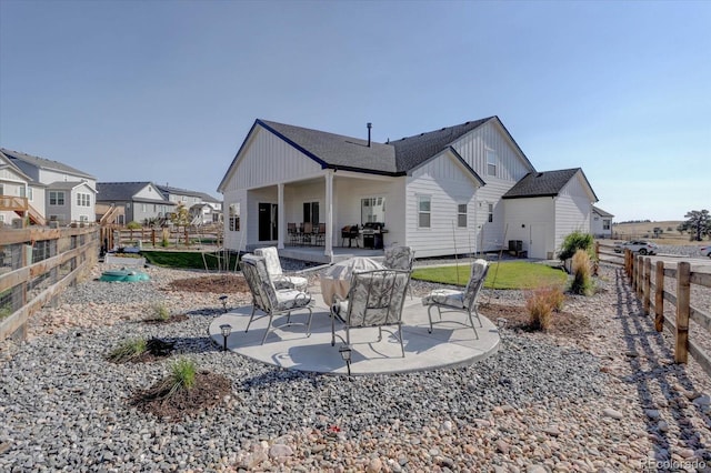 rear view of property featuring central air condition unit and a patio area