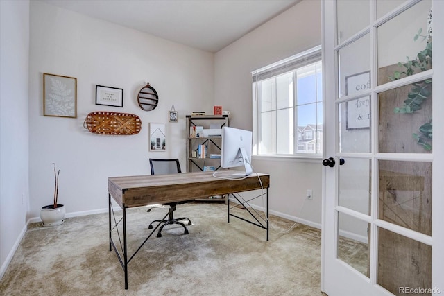 home office featuring french doors and light carpet