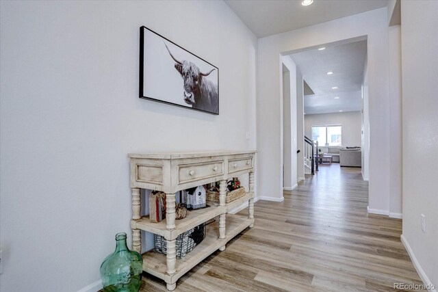 corridor with light hardwood / wood-style flooring