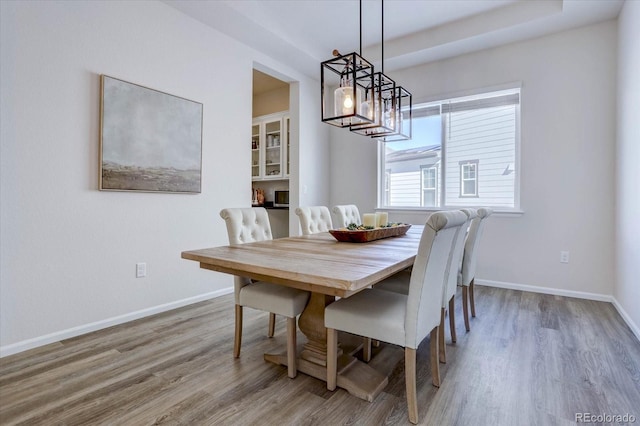 dining space featuring hardwood / wood-style floors