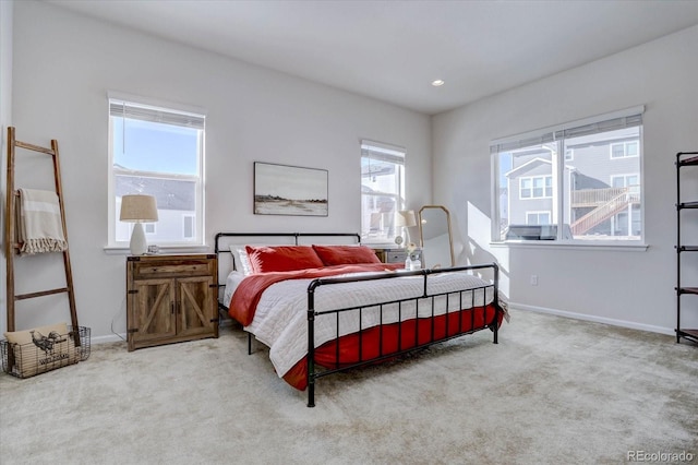 bedroom featuring light colored carpet