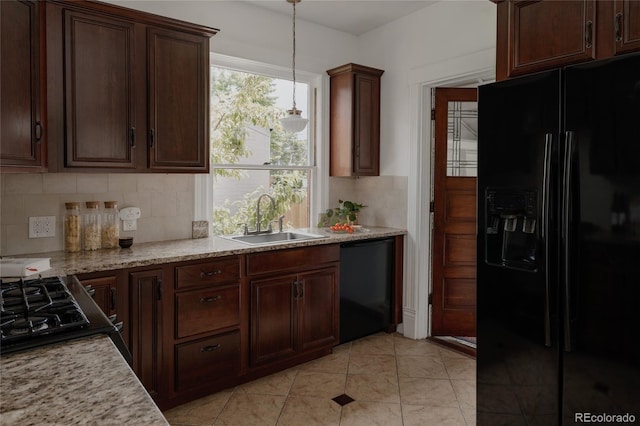 461 S Sherman St, Denver, CO 80209 - kitchen featuring black appliances, tasteful backsplash, decorative light fixtures, dark brown cabinets, and light tile patterned floors