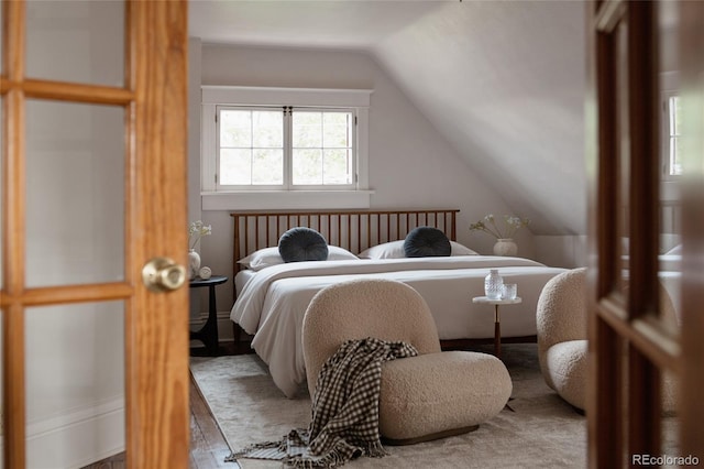 461 S Sherman St, Denver, CO 80209 - bedroom with vaulted ceiling and wood finished floors
