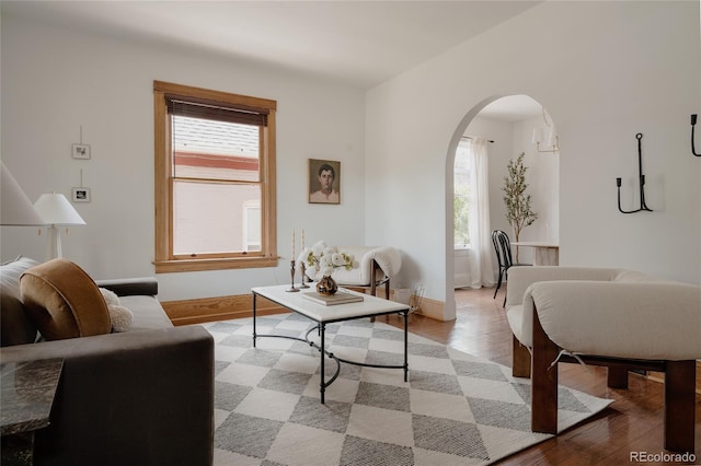 461 S Sherman St, Denver, CO 80209 - living area featuring arched walkways, plenty of natural light, and light wood-type flooring