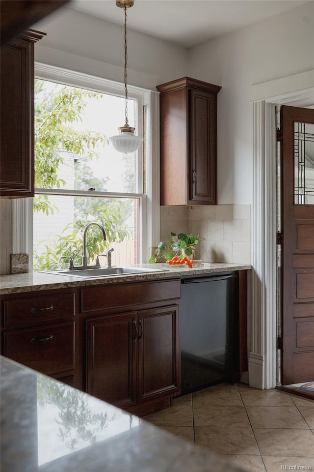 461 S Sherman St, Denver, CO 80209 - kitchen featuring dishwashing machine, backsplash, plenty of natural light, and decorative light fixtures