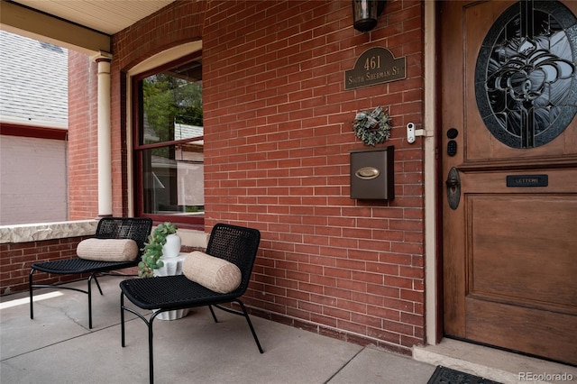 461 S Sherman St, Denver, CO 80209 - view of exterior entry with brick siding and covered porch