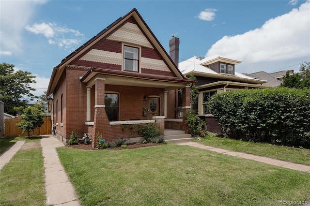 461 S Sherman St, Denver, CO 80209 - victorian house featuring brick siding, covered porch, and a chimney
