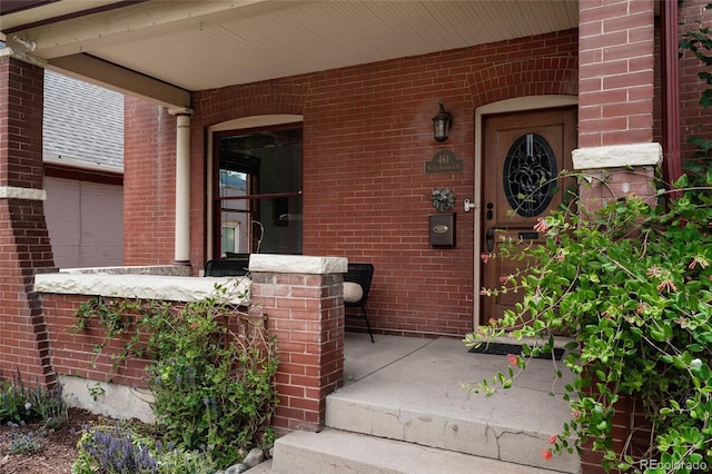 461 S Sherman St, Denver, CO 80209 - entrance to property featuring brick siding and covered porch