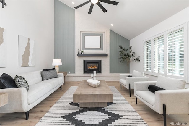 5814 Cole Way, Arvada, CO 80004 - living area with a ceiling fan, wood finished floors, a brick fireplace, high vaulted ceiling, and recessed lighting