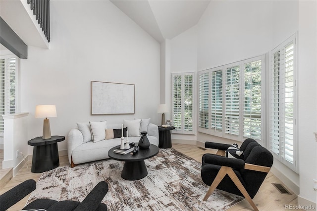 5814 Cole Way, Arvada, CO 80004 - living room featuring plenty of natural light and high vaulted ceiling