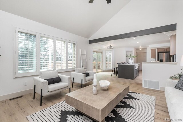 5814 Cole Way, Arvada, CO 80004 - living room with light wood-type flooring, a ceiling fan, and high vaulted ceiling