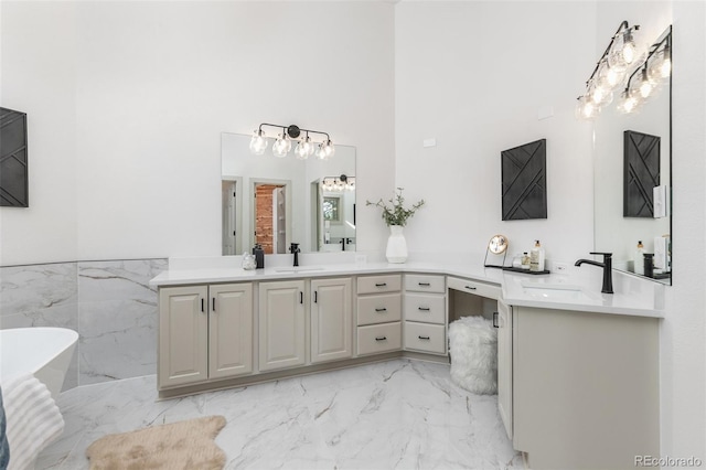 5814 Cole Way, Arvada, CO 80004 - bathroom with marble finish floors, vanity, a soaking tub, and a towering ceiling
