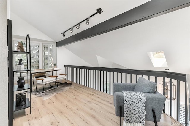 5814 Cole Way, Arvada, CO 80004 - sitting room with a skylight, wood finished floors, high vaulted ceiling, and track lighting