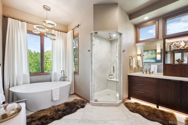 16134 Sandstone Dr, Morrison, CO 80465 - full bath featuring a shower stall, vanity, a soaking tub, and tile patterned floors