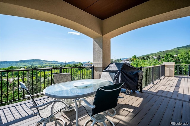 16134 Sandstone Dr, Morrison, CO 80465 - deck featuring a mountain view, a grill, and outdoor dining area