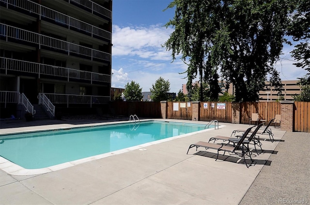 view of swimming pool featuring a patio area