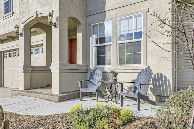 view of exterior entry with stucco siding