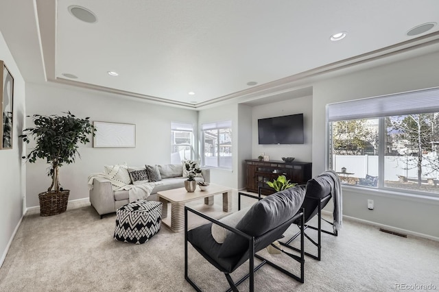 living area featuring baseboards, recessed lighting, visible vents, and light carpet