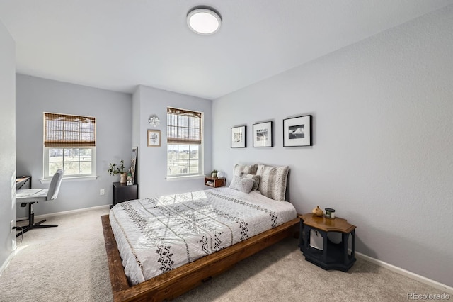 carpeted bedroom with baseboards