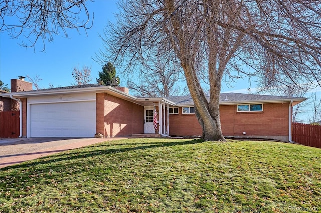 single story home featuring a front yard and a garage