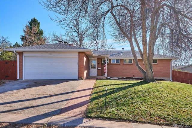 ranch-style home with a garage and a front lawn