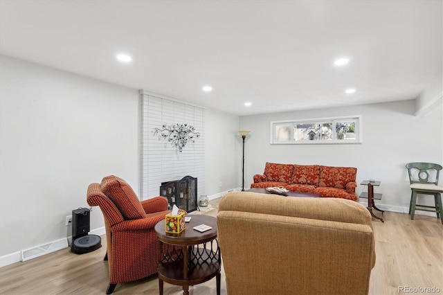 living room with light hardwood / wood-style floors