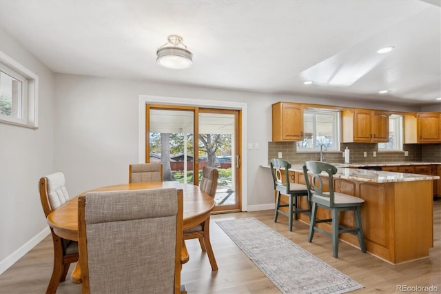 dining space featuring light hardwood / wood-style floors and a wealth of natural light