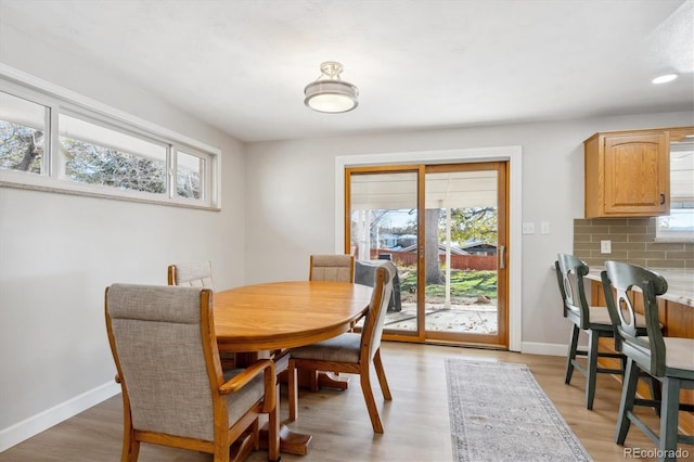 dining space with light wood-type flooring