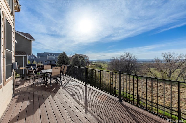 9586 W Victoria Dr, Littleton, CO 80128 - wooden terrace with a residential view and outdoor dining space