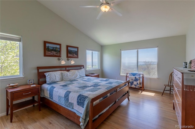 9586 W Victoria Dr, Littleton, CO 80128 - bedroom featuring baseboards, light wood-style floors, high vaulted ceiling, and a ceiling fan