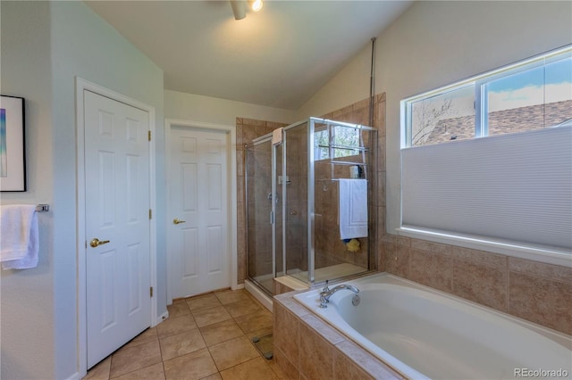 9586 W Victoria Dr, Littleton, CO 80128 - bathroom featuring a stall shower, tile patterned flooring, a bath, and vaulted ceiling