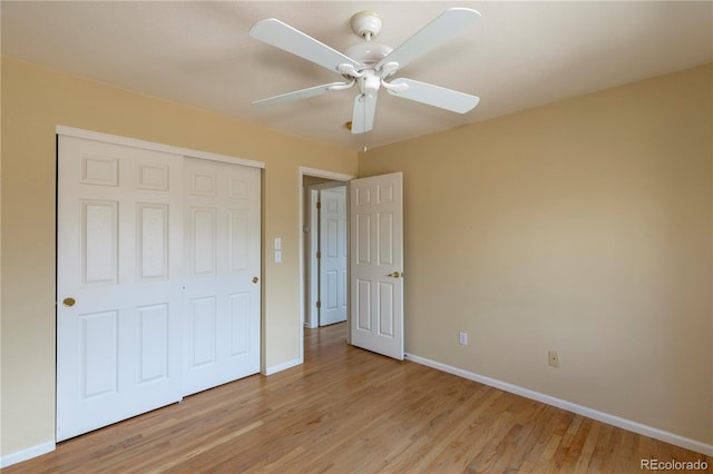 9586 W Victoria Dr, Littleton, CO 80128 - unfurnished bedroom featuring baseboards, a closet, and light wood-style floors