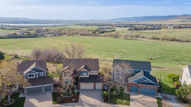9586 W Victoria Dr, Littleton, CO 80128 - drone / aerial view featuring a mountain view and a rural view