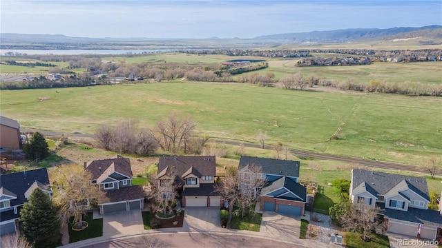 9586 W Victoria Dr, Littleton, CO 80128 - bird's eye view with a rural view and a mountain view