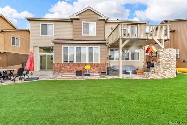 3745 Spanish Oaks Trl, Castle Rock, CO 80108 - rear view of property with a patio area, brick siding, and a yard
