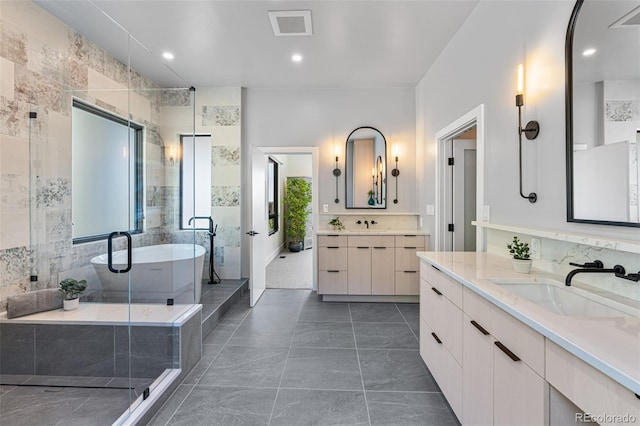 bathroom featuring vanity, plus walk in shower, tile walls, and tile patterned flooring