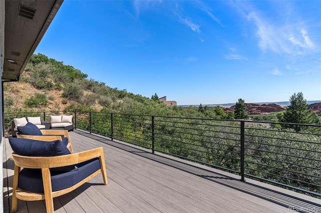 wooden deck with outdoor lounge area