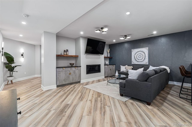 living room with light hardwood / wood-style flooring