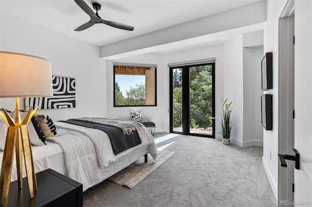 carpeted bedroom featuring ceiling fan and access to outside