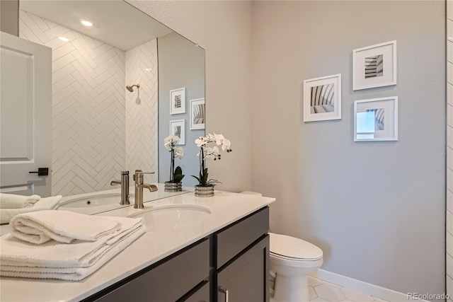 bathroom with tile patterned floors, vanity, and toilet