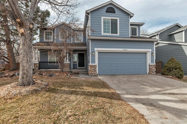 view of front property with a garage and a front yard