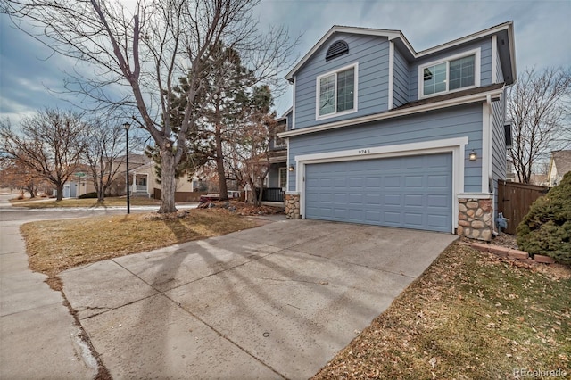 view of front facade with a garage and a front lawn